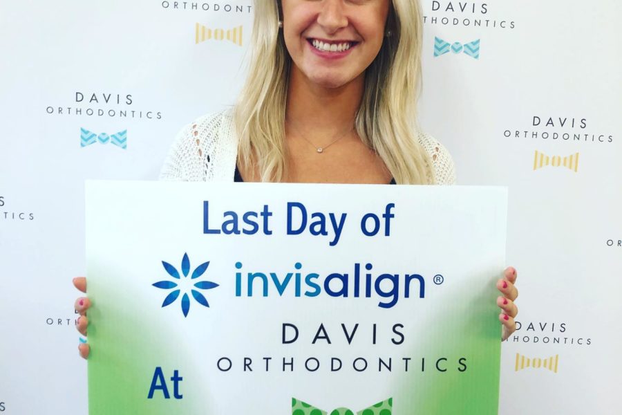 women at her last invisalign treatment at Davis Orthodontics.jpg